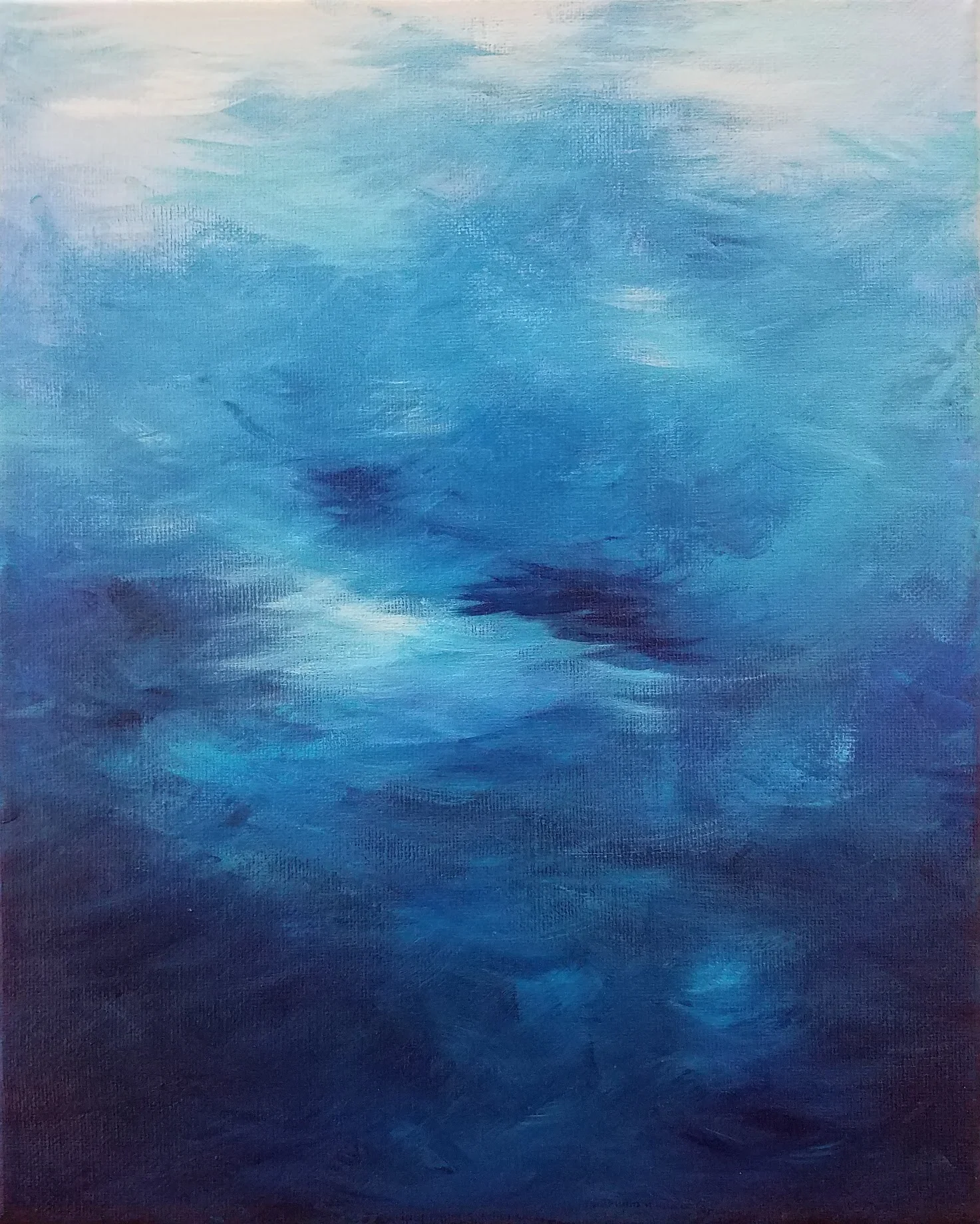Abstract impressionist study of deep blue water with light breaking through the surface